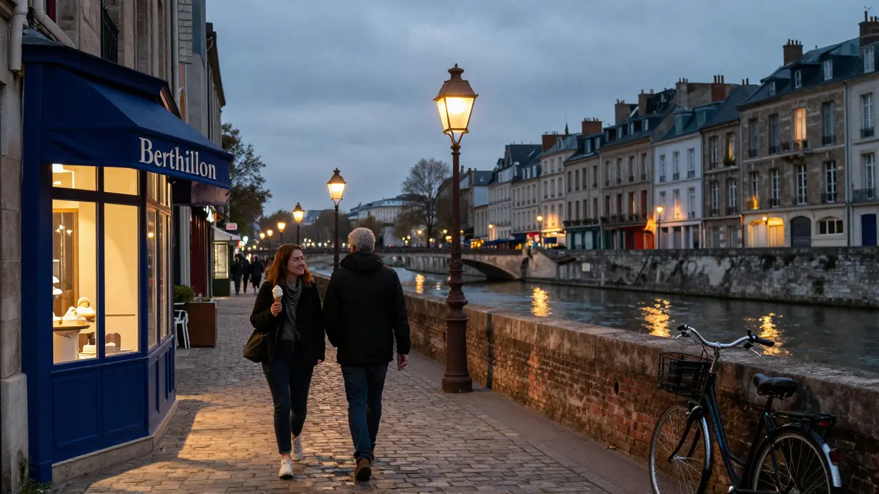 A couple walks hand-in-hand along a quiet island street at twilight, passing a classic ice cream shop with warm window glow.