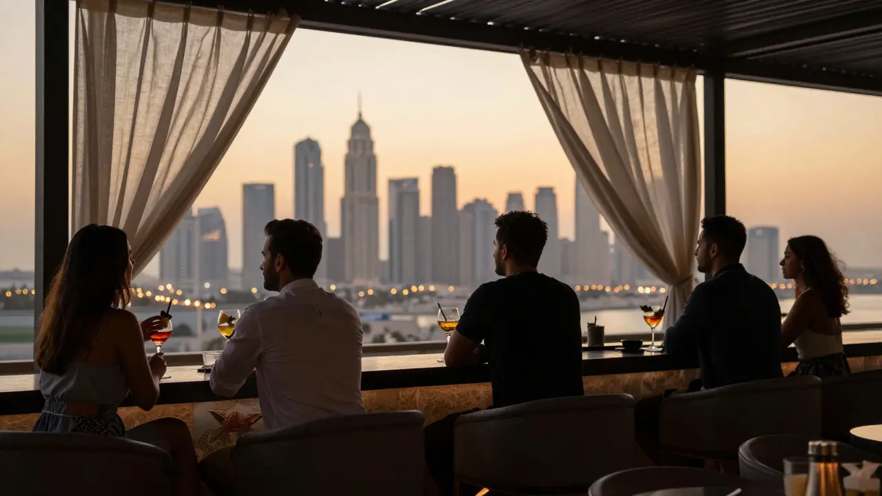 People enjoying cocktails on a rooftop bar at sunset, skyline glowing behind them, relaxed and unassuming.