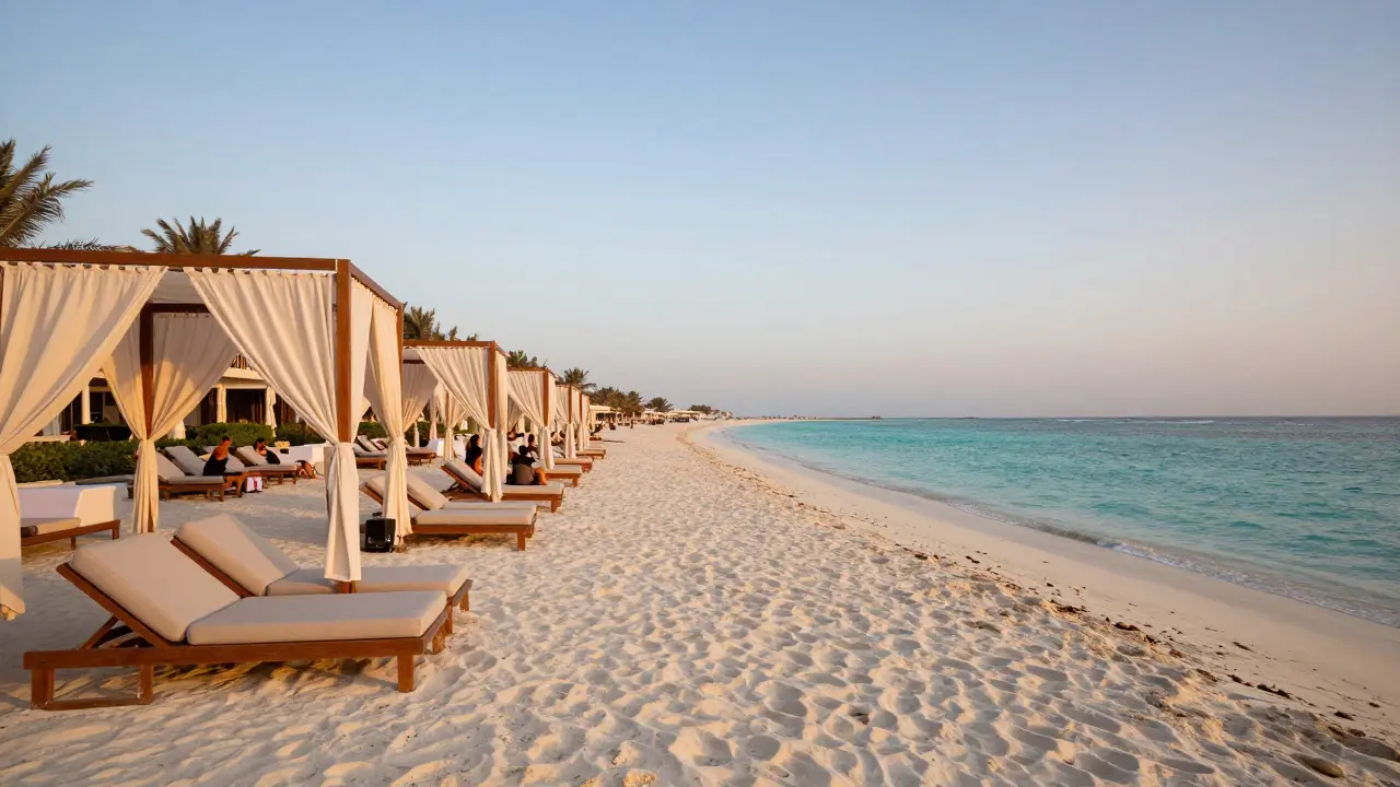 Private beach club cabanas on sand during golden hour